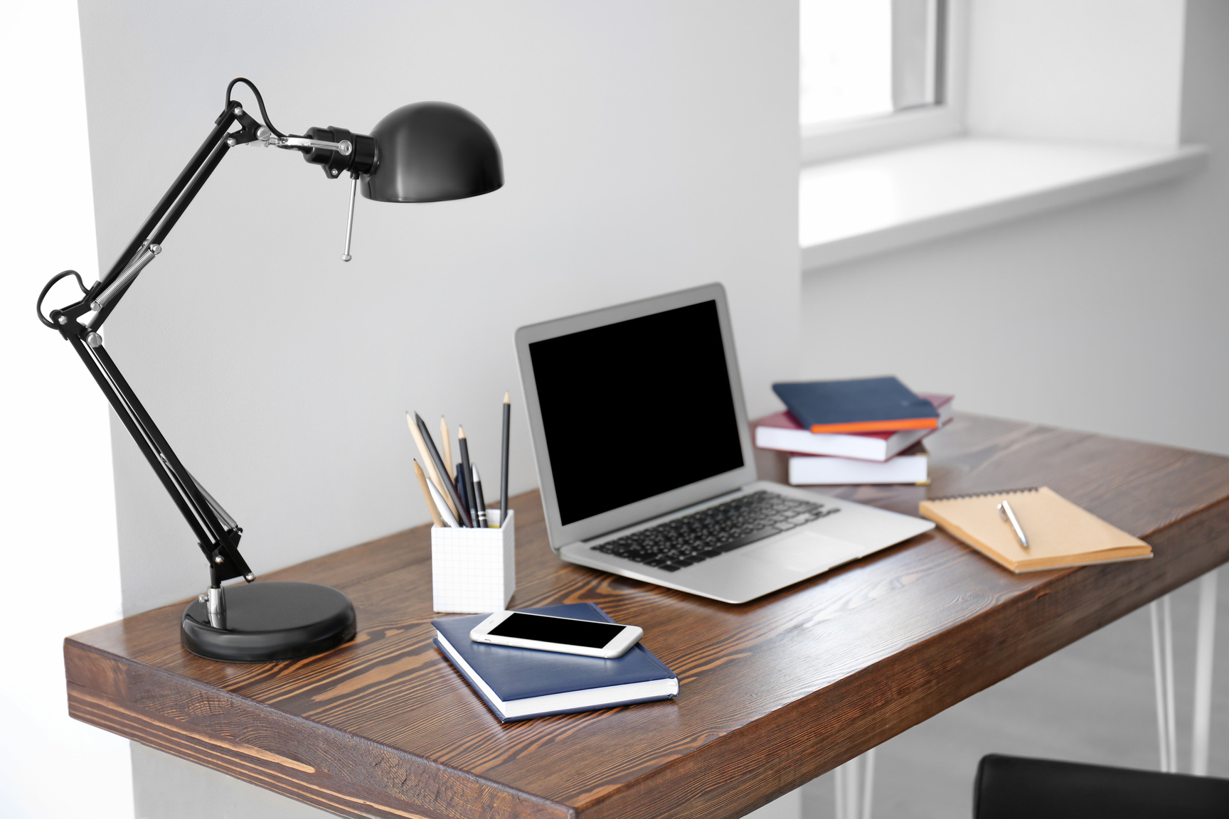 Comfortable Workplace with Laptop on Table in Office